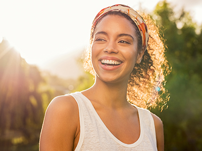 Woman smiling at sunset