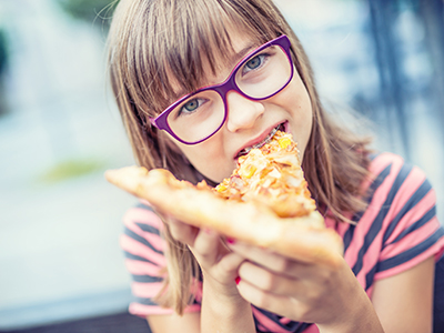 Child teenager with pizza